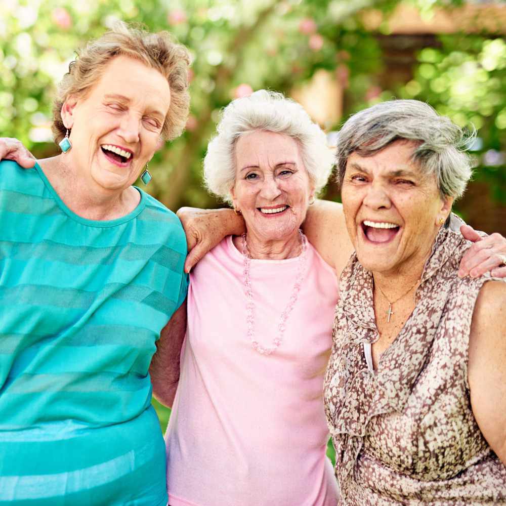 portrait park senior women with smile friends bonding retirement group happy with hug outdoor embrace reunion mature people relationship together nature love